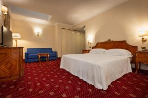 Postel nebo postele na pokoji v ubytování Hotel Stendhal