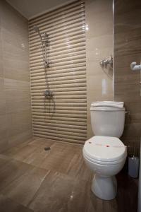 A bathroom at AquaSun Family Hotel
