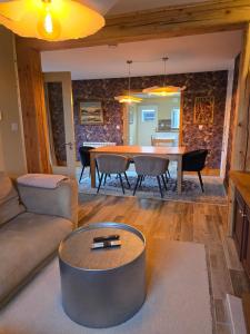 a living room with a table and a couch at Cozy Town house in Athlone +10 photos