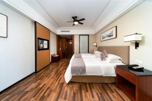 Luoxingge SSAW Boutiquel Hotel客房内的一张或多张床位