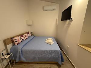 Ένα ή περισσότερα κρεβάτια σε δωμάτιο στο A Casa di Nonna
