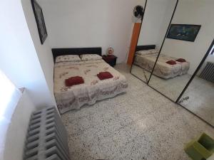 Postel nebo postele na pokoji v ubytování Parco Gessilandia