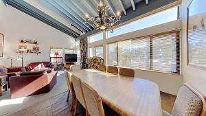 a dining room with a table and chairs at Large Spacious Upgraded 4 Bedroom Condo in Mammoth Lakes +58 photos