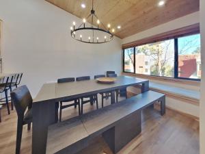 a dining room with a blue table and chairs at Spacious 3 BR Condo with Loft in Mammoth Lakes