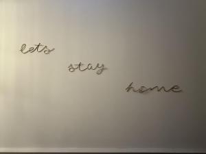 a writing on a wall with the words lets way home at Murraygate Townhouse in Dundee