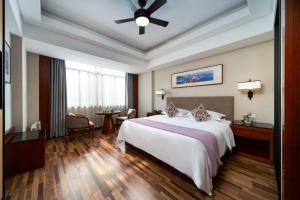 Luoxingge SSAW Boutiquel Hotel客房内的一张或多张床位