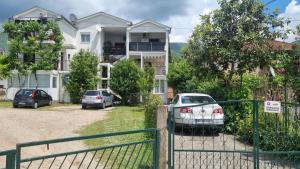 a house with cars parked in front of it at Boka Bliss in Zelenika