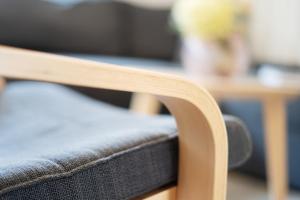 a close up of a wooden chair with a table at Gästehaus Sulsdorf Wohnung 20 in Sulsdorf auf Fehmarn