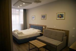A seating area at AquaSun Family Hotel