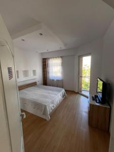 Ένα ή περισσότερα κρεβάτια σε δωμάτιο στο Apartament Flammarion