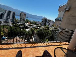 a balcony with a view of a city at Apartman Krsto 1 in Budva +5 photos
