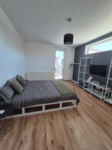 Postel nebo postele na pokoji v ubytování La Maisonette