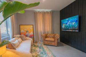 a living room with a couch and a chair at Apartment 2 Bedrooms & Terrace - Fully Air-Conditioned - King Size Beds in Sélestat