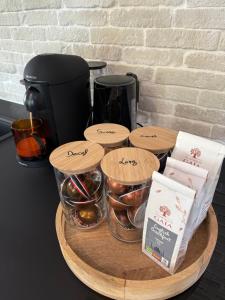 a table with bowls of food and a coffee maker at Apartment 2 Bedrooms & Terrace - Fully Air-Conditioned - King Size Beds in Sélestat