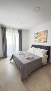 Ένα ή περισσότερα κρεβάτια σε δωμάτιο στο I TRAMONTI DEL GOLFO - Rooms & Luxury apartment +20 φωτογραφίες