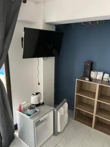 a living room with a flat screen tv on the wall at PINK HOUSE KOH SAMUI - Exclusive Private Villa in Ban Lamai