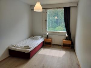Postel nebo postele na pokoji v ubytování Kotimaailma Apartments Lohja - 2BR apartment