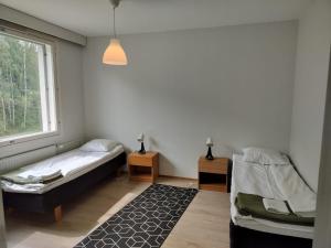 Postel nebo postele na pokoji v ubytování Kotimaailma Apartments Lohja - 2BR apartment