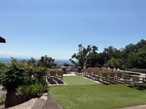 a row of chairs sitting on top of a lawn at Domaine du Haut-Koenigsbourg in Orschwiller