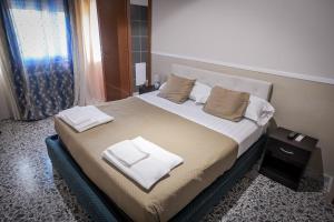 Postel nebo postele na pokoji v ubytování B&B Garibaldi