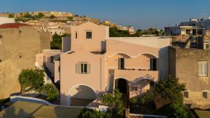 a view of a house in a city at Orìgenes Rooms in Procida