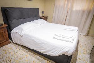 Postel nebo postele na pokoji v ubytování B&B Garibaldi