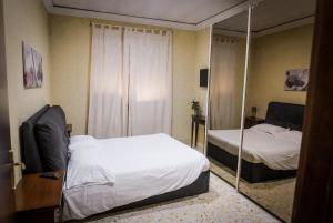 Postel nebo postele na pokoji v ubytování B&B Garibaldi
