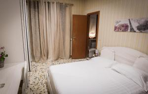 Postel nebo postele na pokoji v ubytování B&B Garibaldi