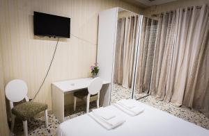 Postel nebo postele na pokoji v ubytování B&B Garibaldi