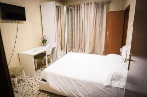 Postel nebo postele na pokoji v ubytování B&B Garibaldi