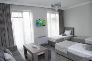 Postel nebo postele na pokoji v ubytování Max Hotel