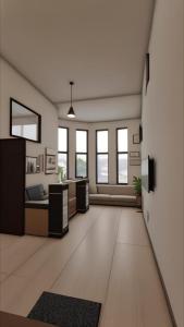 an empty office with a large room with windows at Anargh Holidays Inn in Kumbhalgarh +42 photos