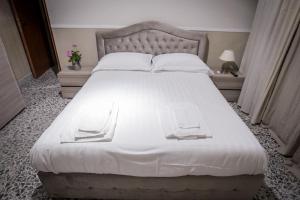 Postel nebo postele na pokoji v ubytování B&B Garibaldi