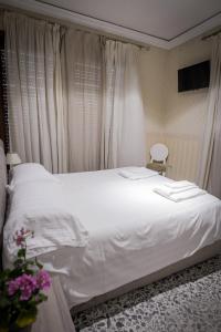 Postel nebo postele na pokoji v ubytování B&B Garibaldi
