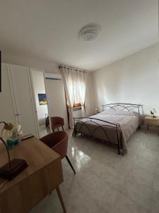 Postel nebo postele na pokoji v ubytování Mesciu Cesare B&B