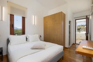 A bed or beds in a room at Villa Elesia