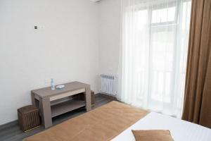 Postel nebo postele na pokoji v ubytování Max Hotel