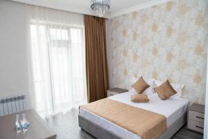 Postel nebo postele na pokoji v ubytování Max Hotel