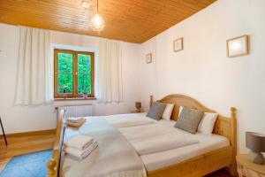 Postel nebo postele na pokoji v ubytování Die Bäckeralm