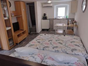a bedroom with a large bed in a room at Apartment ANGELOVE in Senj