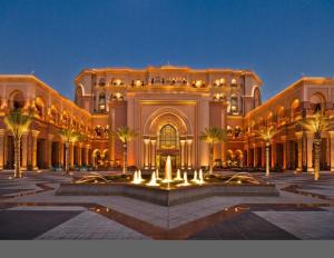 a large building with a fountain in front of it at Belvilla Top Stars Hotel Near Gold Souk in Abu Dhabi