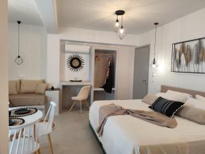 a bedroom with a bed and a living room at lemon in Agia Anna Naxos