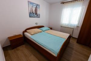 Posteľ alebo postele v izbe v ubytovaní Apartman Boris