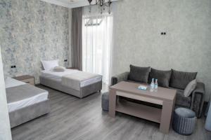 Postel nebo postele na pokoji v ubytování Max Hotel