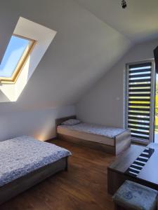 Postel nebo postele na pokoji v ubytování Relax u Agi i Jurka