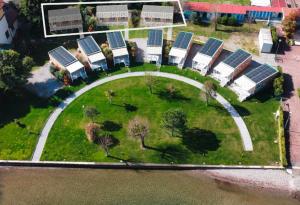an aerial view of an island with solar panels at Belvedere Clusane Camping in Iseo