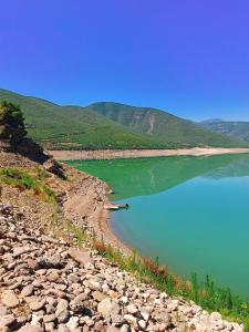 a view of a body of water with mountains in the background at SuperPanorama GuestHouse in Kukës