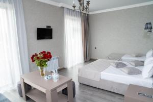 Postel nebo postele na pokoji v ubytování Max Hotel