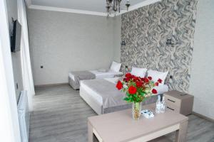 Postel nebo postele na pokoji v ubytování Max Hotel