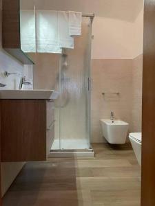 a bathroom with a shower and a sink and a toilet at Casa vacanza dai Nonni Ntoni in Acquarica del Capo